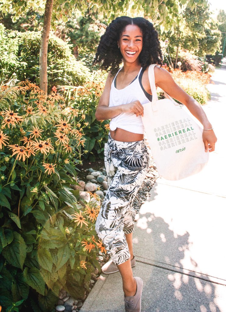 Black Influencer posing with an AerieReal Bag, an example of an Instagram Brand Ambassador Program that is not a scam.